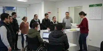 Diverse group understanding SSDI changes 2026 in a government office.